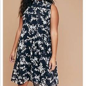 Metallic floral mock-neck swing dress.
